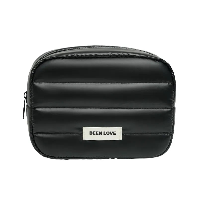 Front view of starry glow patterned makeup bag with handheld strap