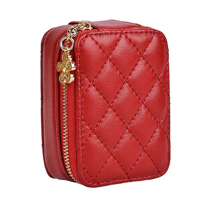 Open leather makeup bag revealing interior compartment and built-in mirror