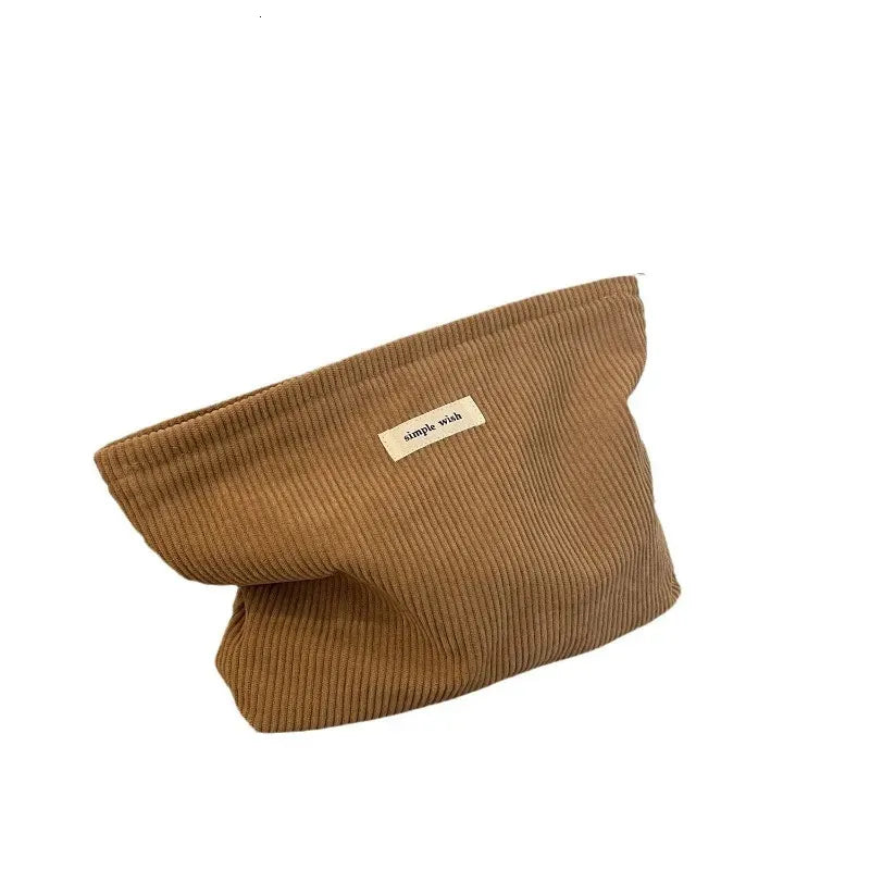 Corduroy toiletry bag with Maillard color pattern shown in khaki