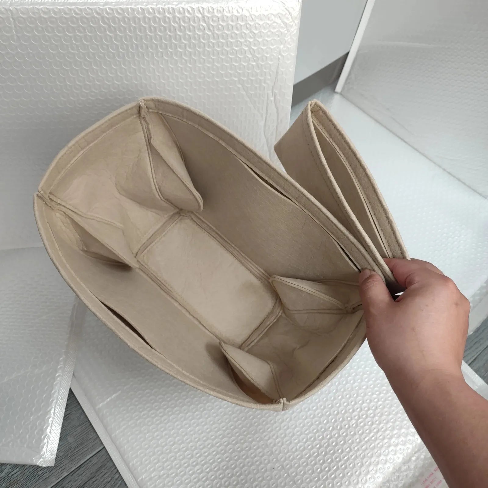 Close-up view of wallet-style compartments inside organizer