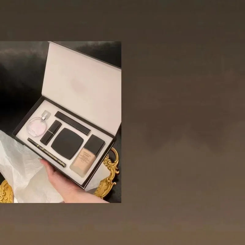 Makeup set with perfume and cosmetics displayed in an open box