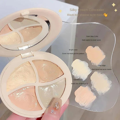 Open cosmetic palette showing multiple shades of concealer cream