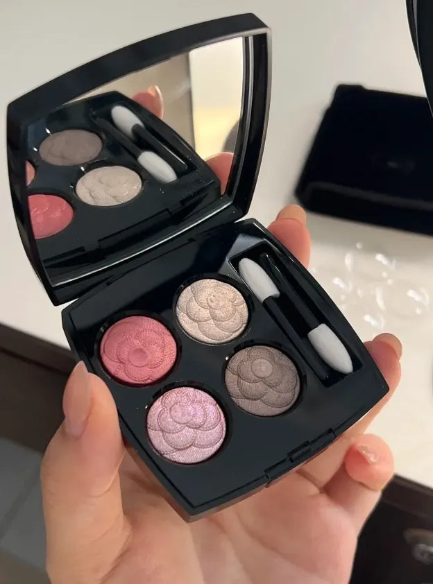 Four-color eyeshadow palette showing matte and shimmer shades