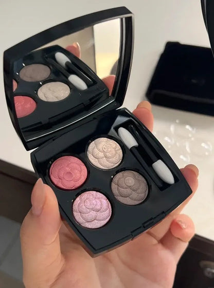 Four-color eyeshadow palette showing matte and shimmer shades