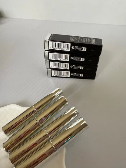 Concealer stick with product visible, demonstrating compact size