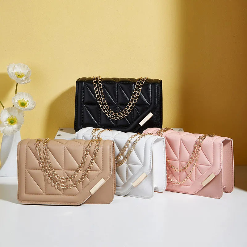 Front view of embossed small square shoulder bag with chain strap