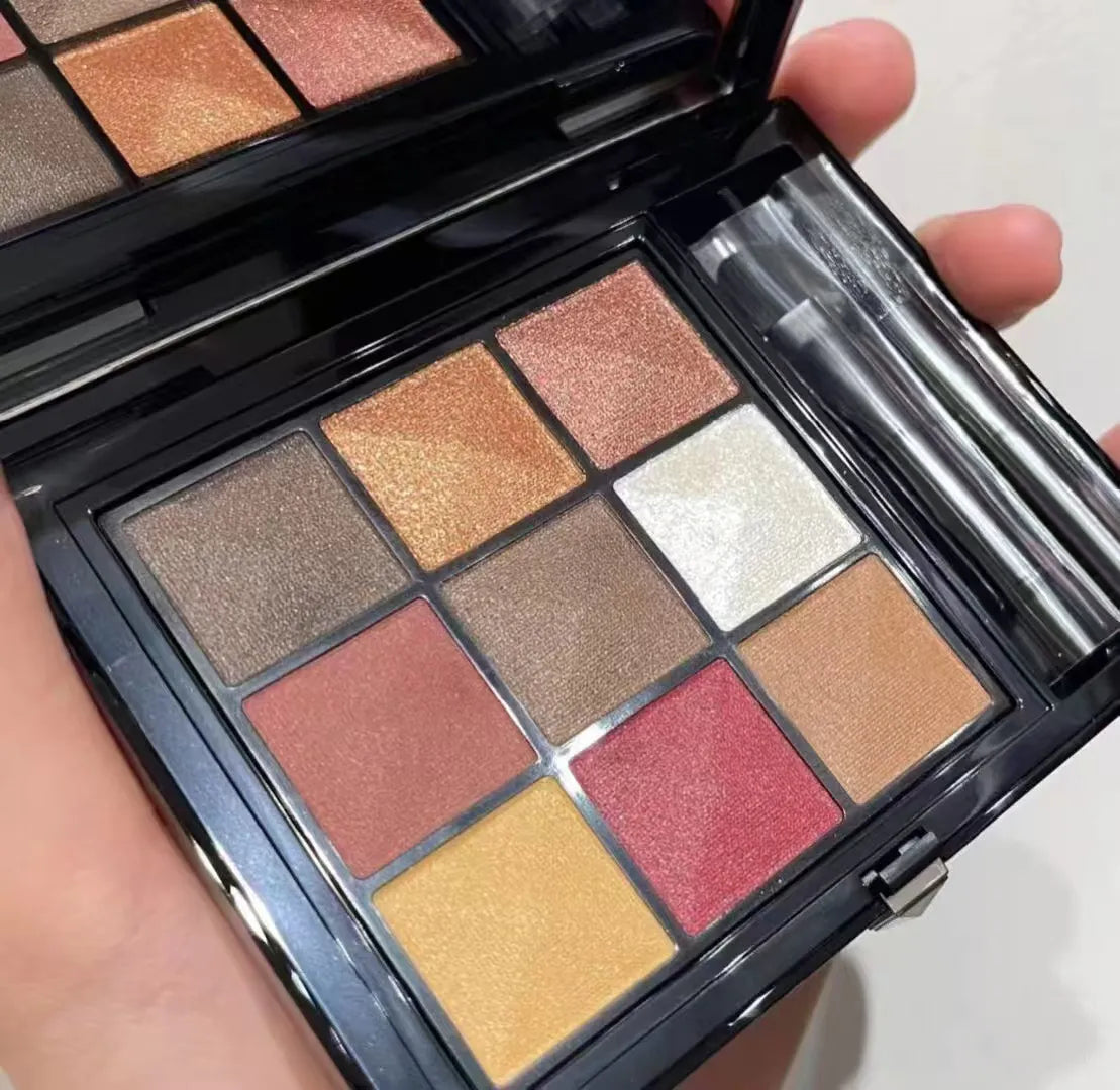 Nine-color eyeshadow palette showing shimmer and glitter finishes
