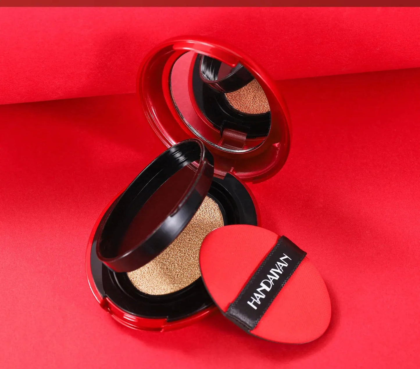 Cream concealer product in a compact container with applicator