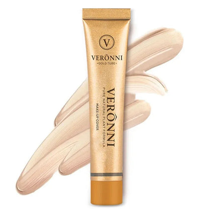 Cream concealer stick in multiple shades arranged on white surface