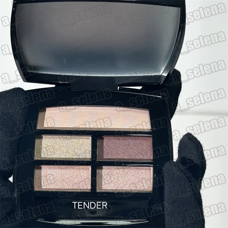 Four matte eyeshadow shades in warm colors displayed in a palette