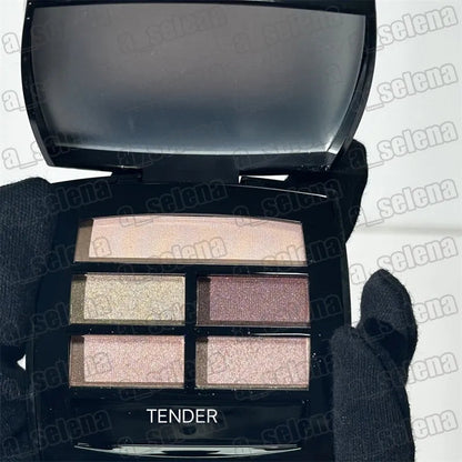 Four matte eyeshadow shades in warm colors displayed in a palette