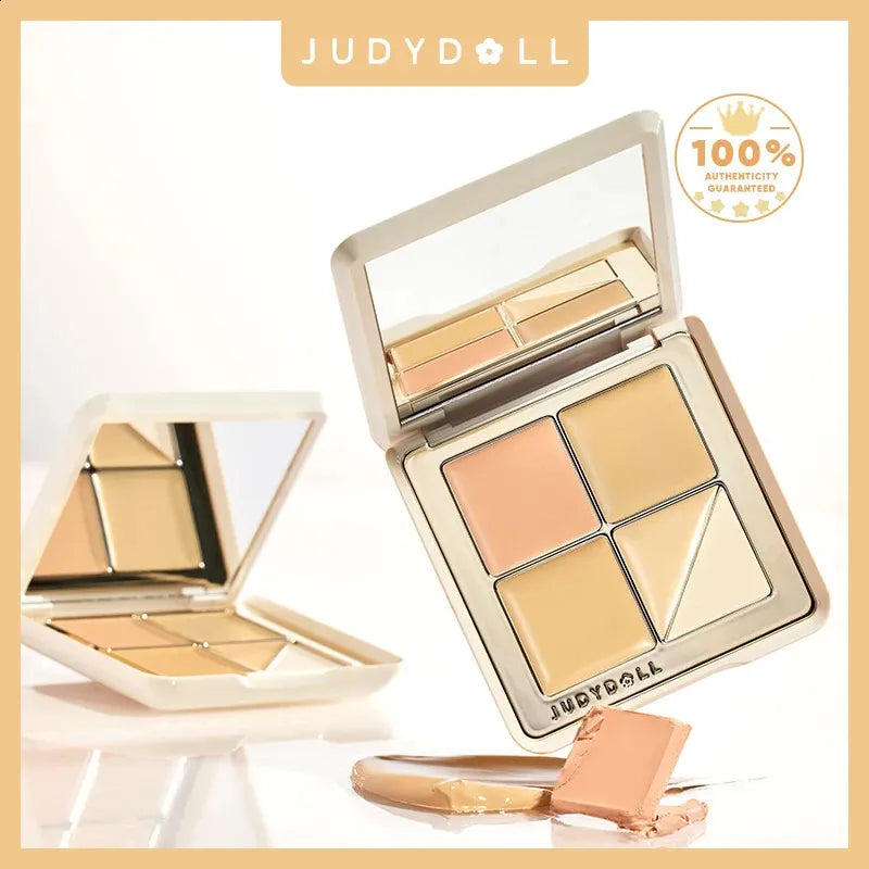 Open concealer palette showing five different shades including a salmon