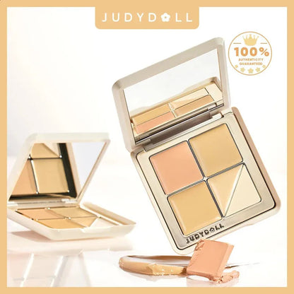 Open concealer palette showing five different shades including a salmon