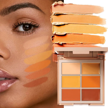 Open concealer palette showing multiple shade options arranged in compact