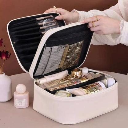 Open view showing interior organization of cosmetic bag