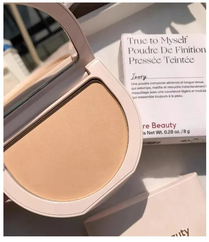 Swatch demonstration showing three different powder shades on skin