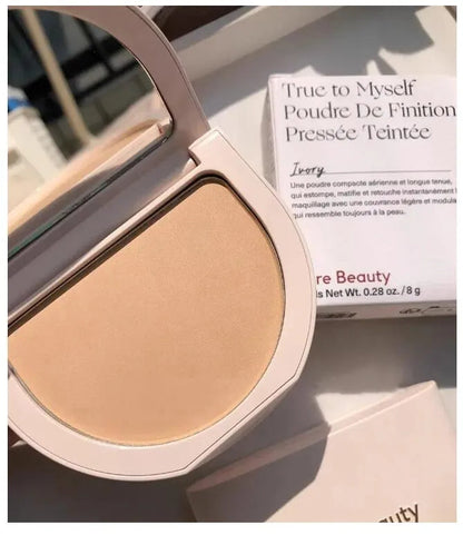 Swatch demonstration showing three different powder shades on skin