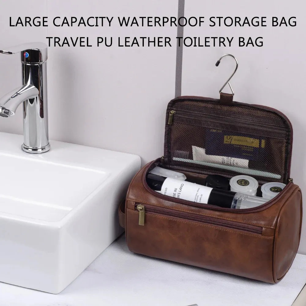 Leather hanging toiletry bag shown in black color with compartments open