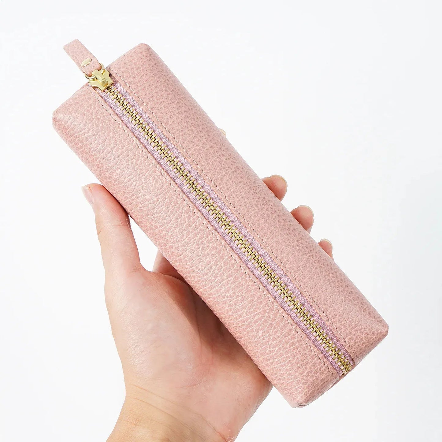 Side profile of monogrammed leather pen box displaying craftsmanship details