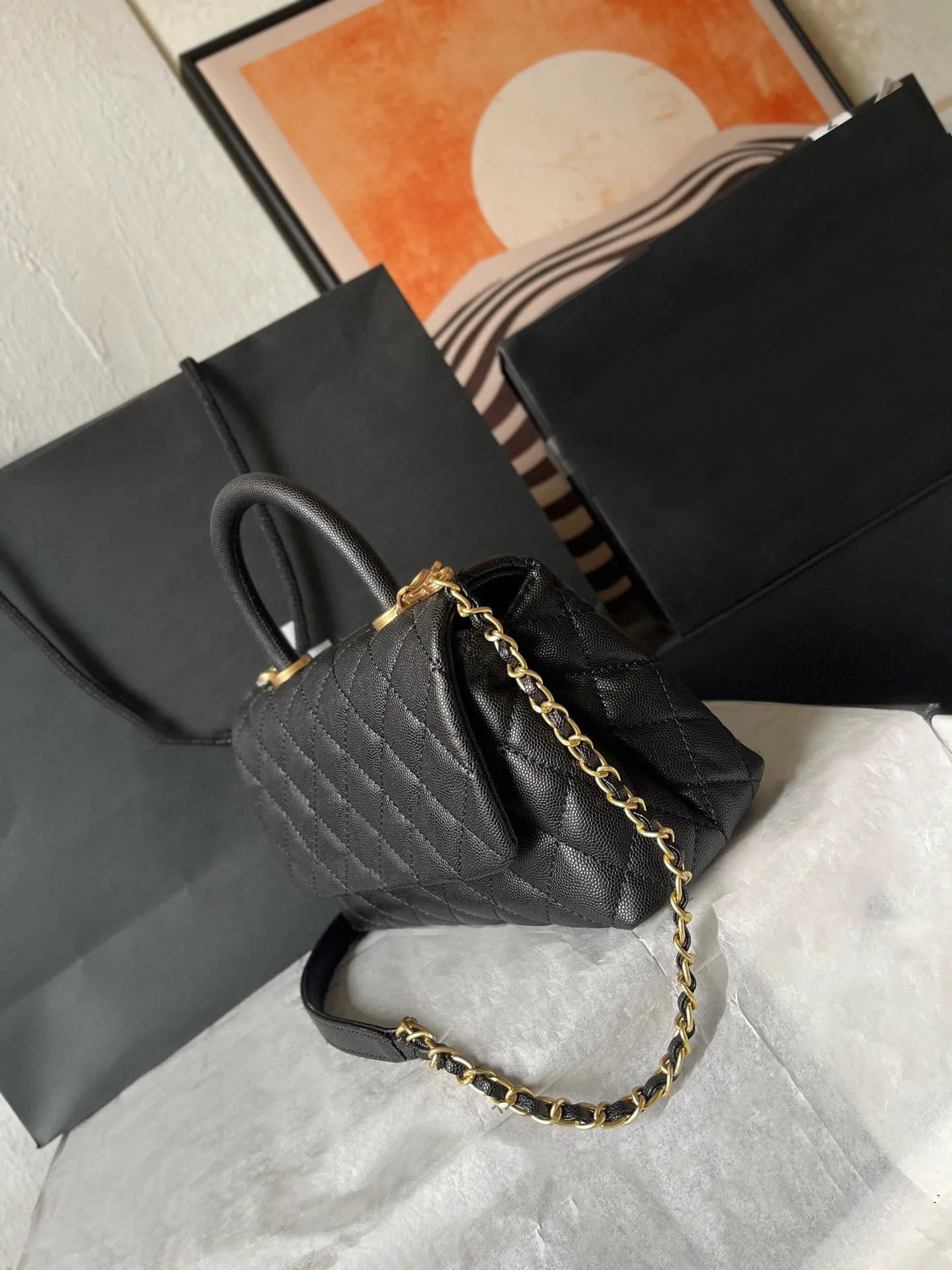 Side angle showing the adjustable strap and structured design of the leather bag