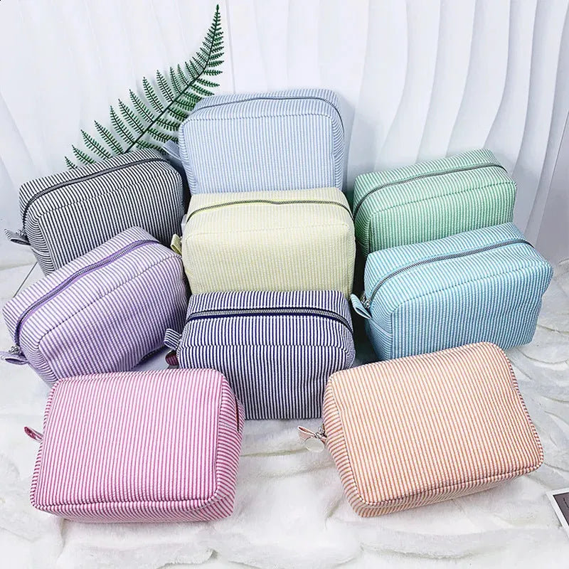 Cosmetic bag shown open to display interior storage capacity