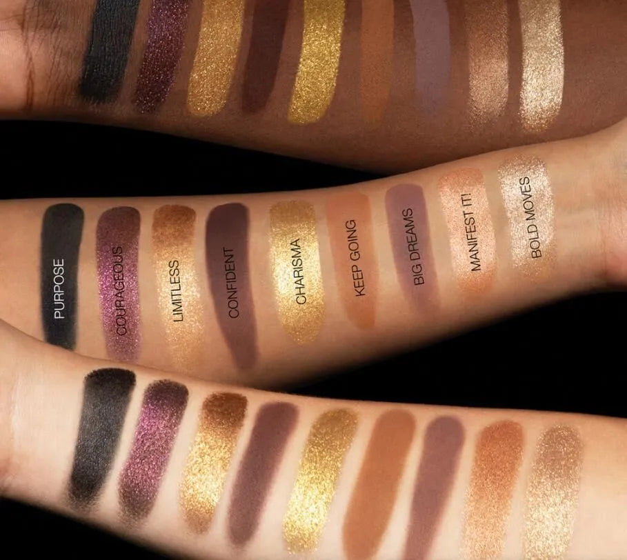 Eyeshadow palette in use with makeup brush applying shimmer shade