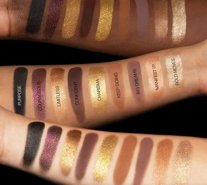 Eyeshadow palette in use with makeup brush applying shimmer shade