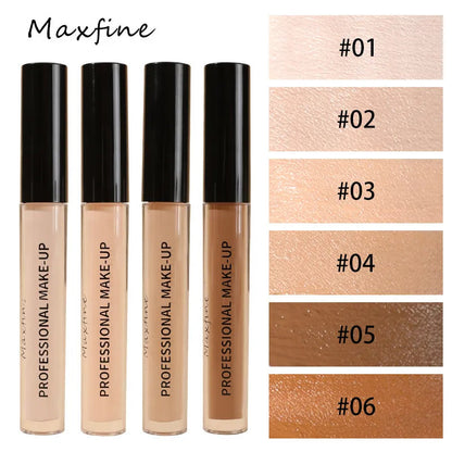Close-up view of concealer being applied to skin with a brush applicator