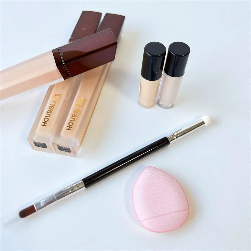 Liquid concealer stick in neutral packaging with applicator tip visible