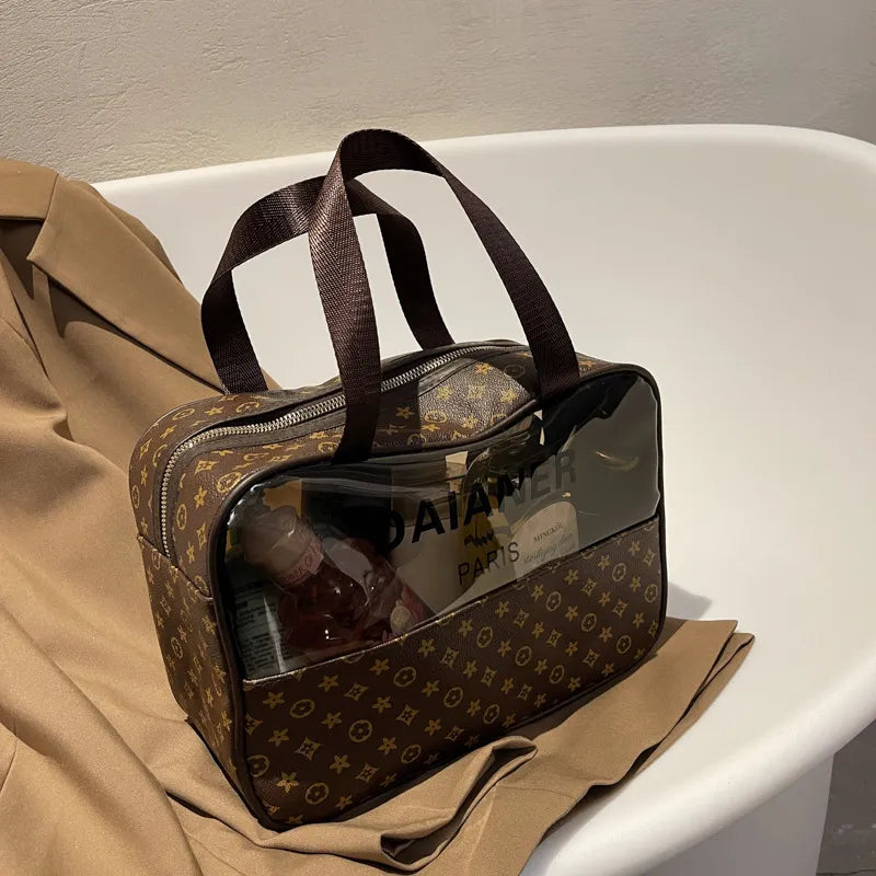 Waterproof toiletry bag with zippered closure open to show interior