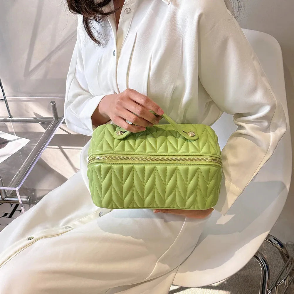 Side perspective of the lightweight travel makeup storage pouch