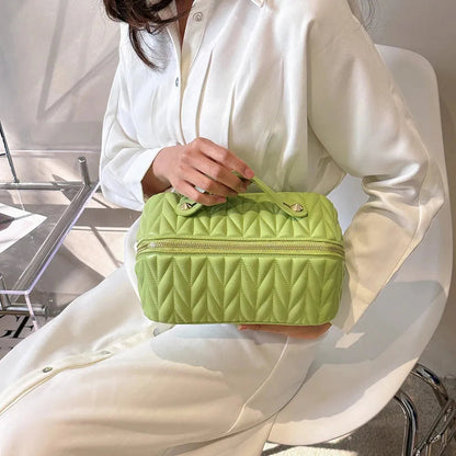 Side perspective of the lightweight travel makeup storage pouch