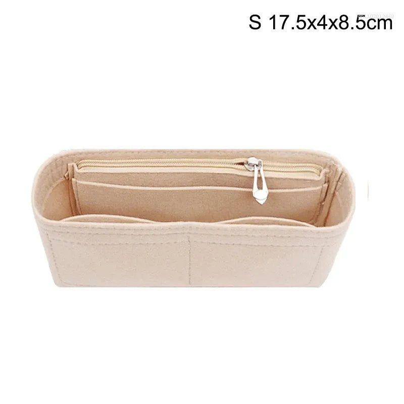 Beige felt bag organizer displayed open to show internal storage pockets