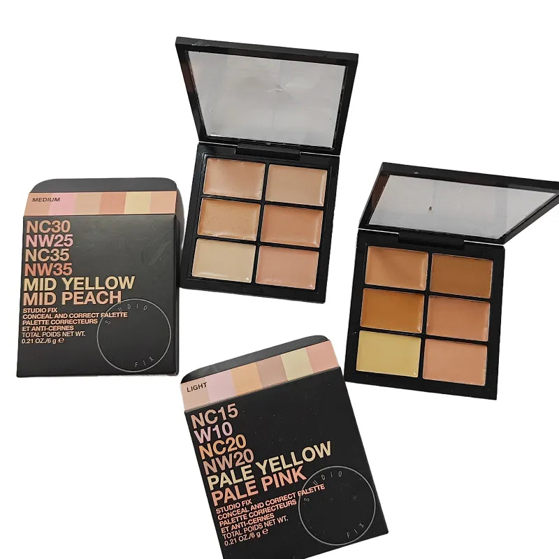 Open makeup palette showing six cream concealer shades arranged in two rows