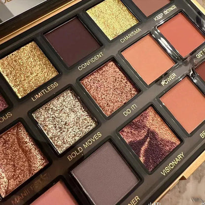 Open eyeshadow palette displaying neutral, rose gold, and deeper tone shades