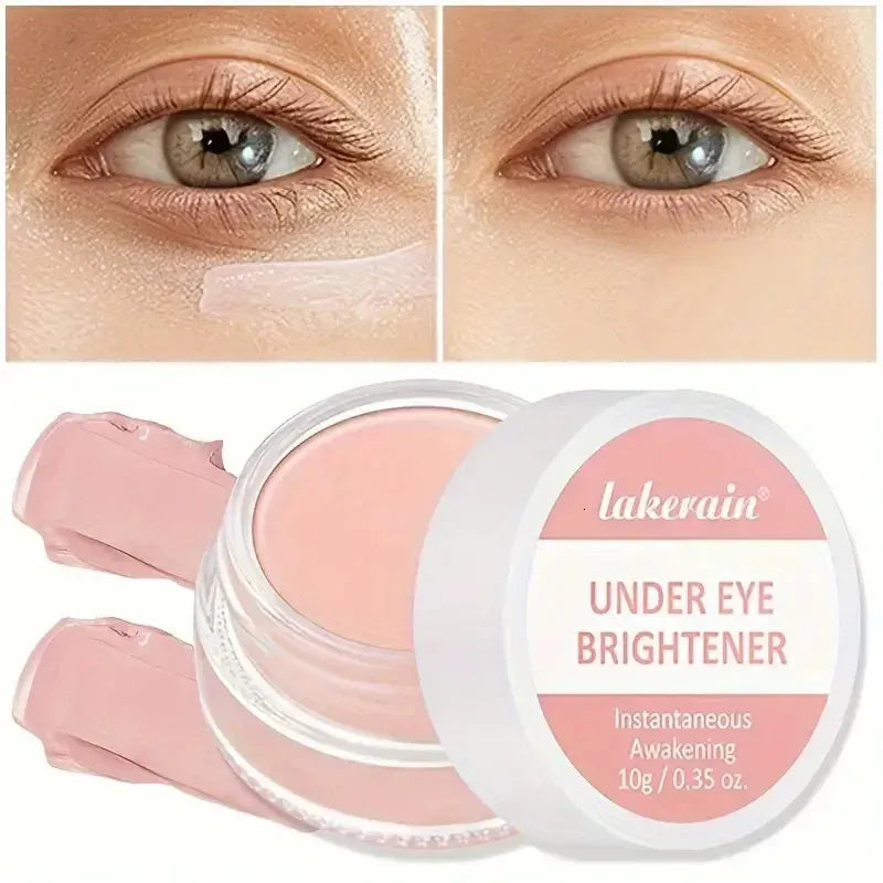 Close-up view of concealer cream being applied to under-eye area