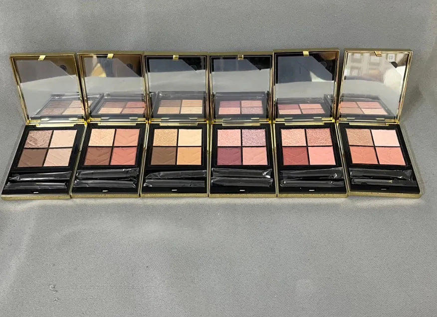 Open view of eyeshadow palette displaying four different color shades