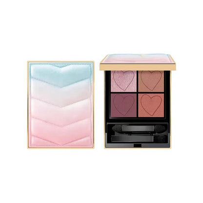 Compact eyeshadow palette open showing matte shades and included brush