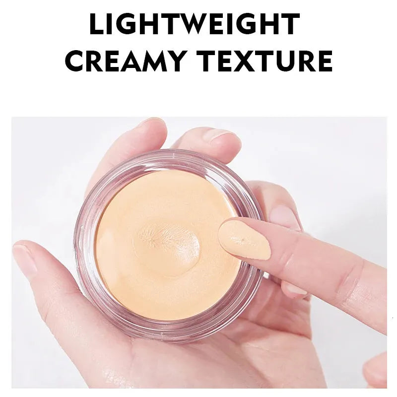 Close-up view of creamy concealer texture being swatched on skin surface