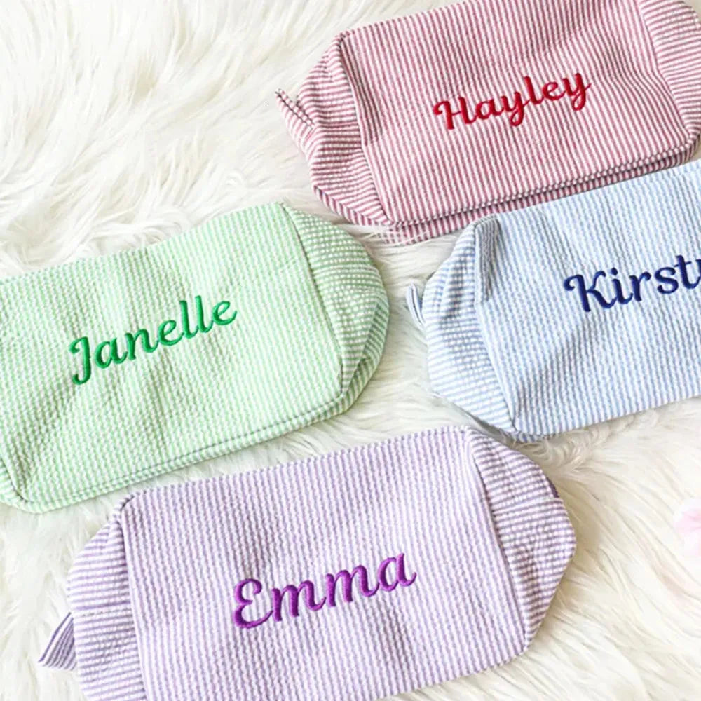 Front view of personalized seersucker cosmetic bag with monogram embroidery