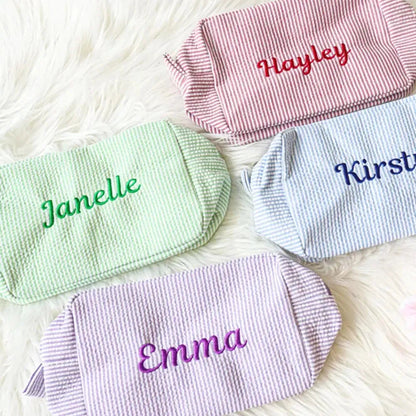 Front view of personalized seersucker cosmetic bag with monogram embroidery