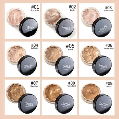 Concealer cream in a compact container with applicator