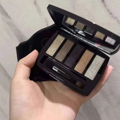 Close-up view of eyeshadow palette with five complementary shades