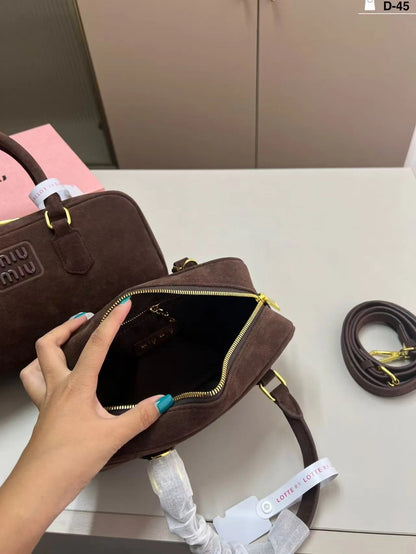 Women's bowling handbag in dark grey color with adjustable strap