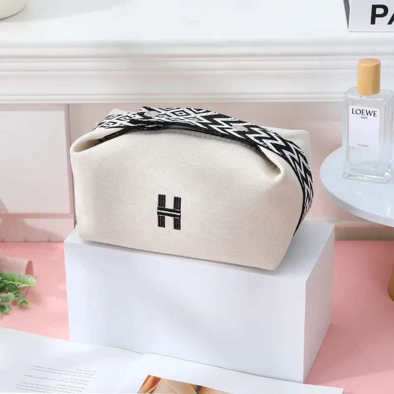 Interior view of cosmetics bag showing spacious compartment for toiletries