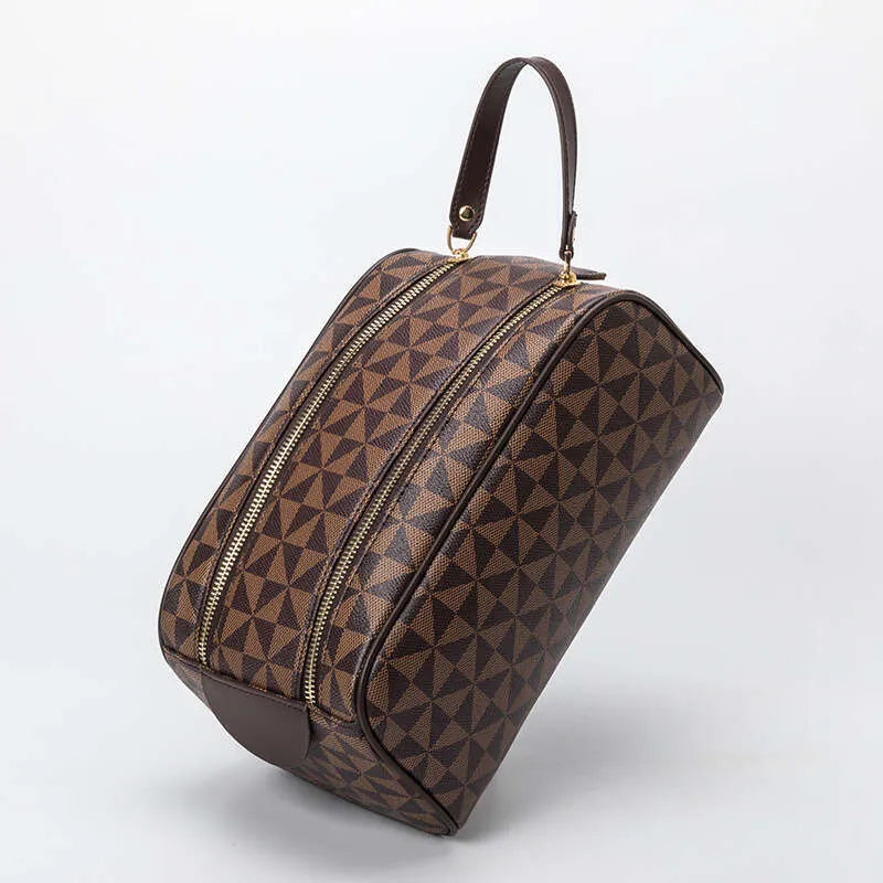 Leather cosmetic bag with double zipper closure in closed position