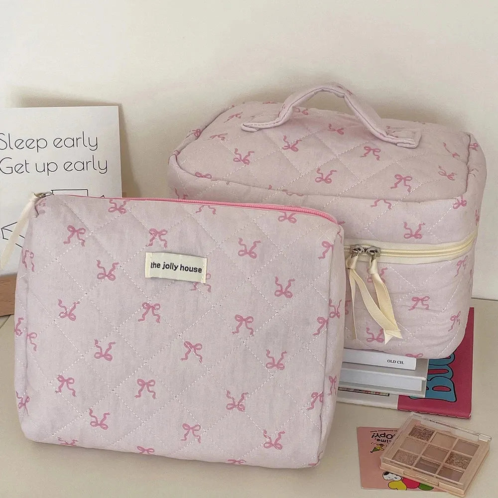 Open cosmetic bag showing interior compartments and zipper closure