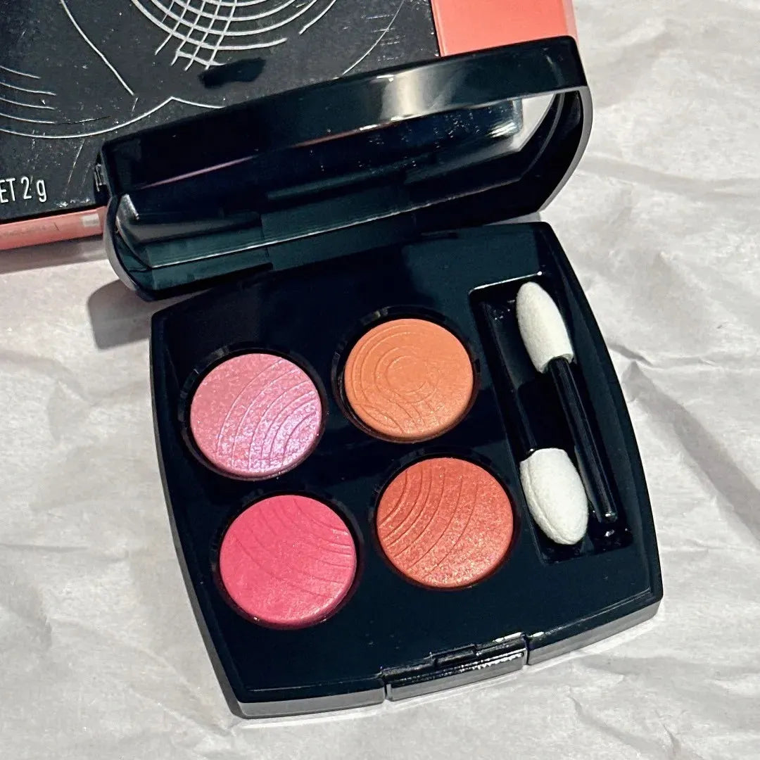 Compact eyeshadow palette showing neutral and vibrant tones