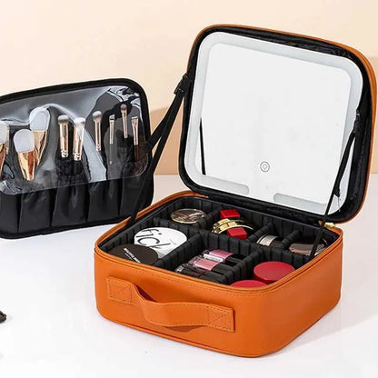 Makeup case interior with brush holder section and multiple storage partitions