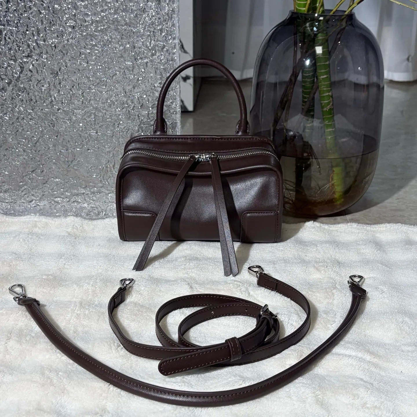 Front view of a luxury shoulder tote bag showing design and strap